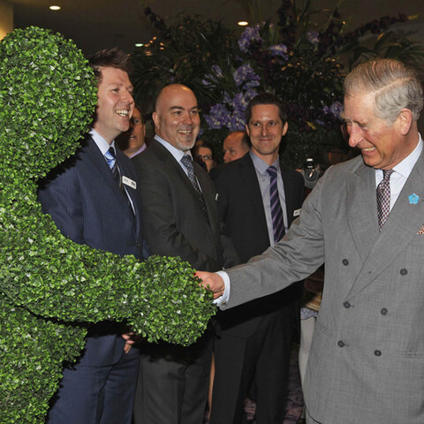 A Hedge Man meeting King Charles at an exhibition in London